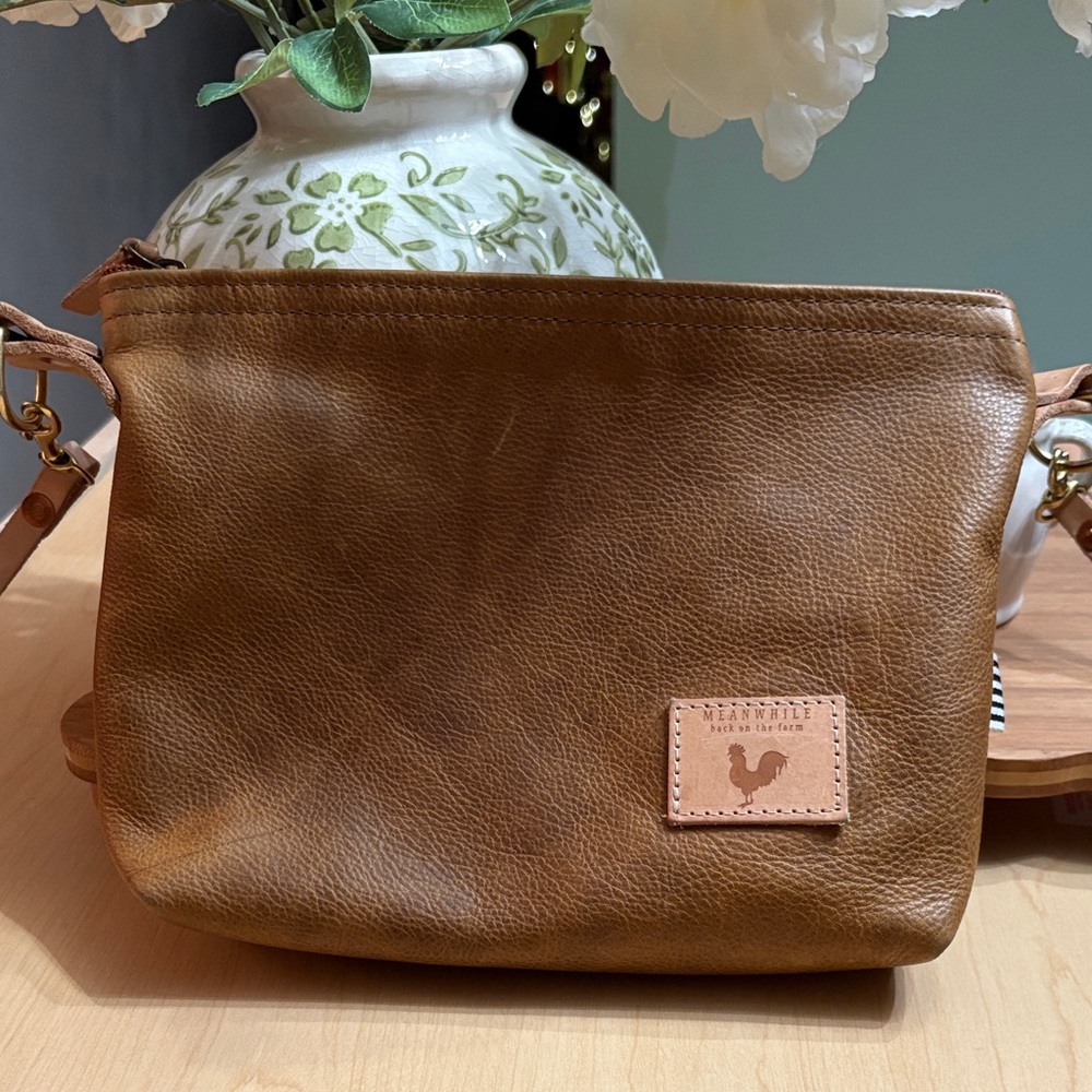 Meanwhile, Back On The Farm camel leather sling bag